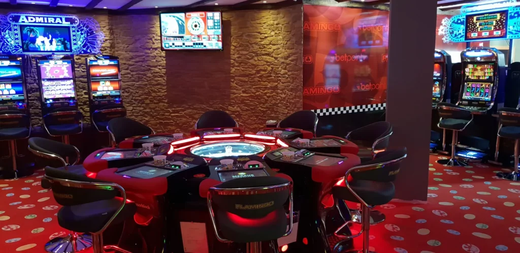 Inside the Salón Costa in Cala Millor, featuring gaming tables and slot machines